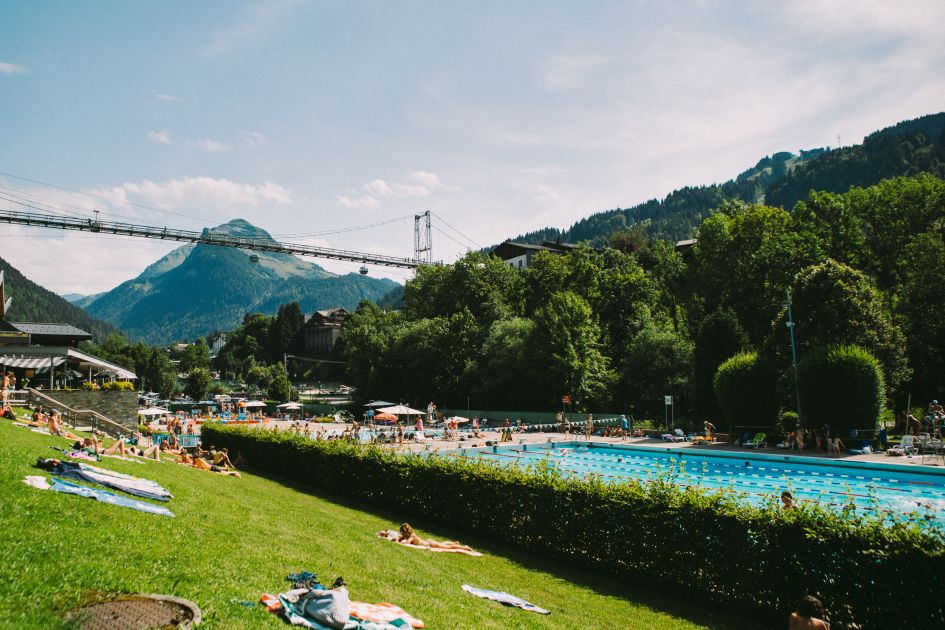 View of Parc des Dérêches and Morzine suspension bridge on a summer's day - there's more to luxury mountain biking holidays in Morzine than just the trails!