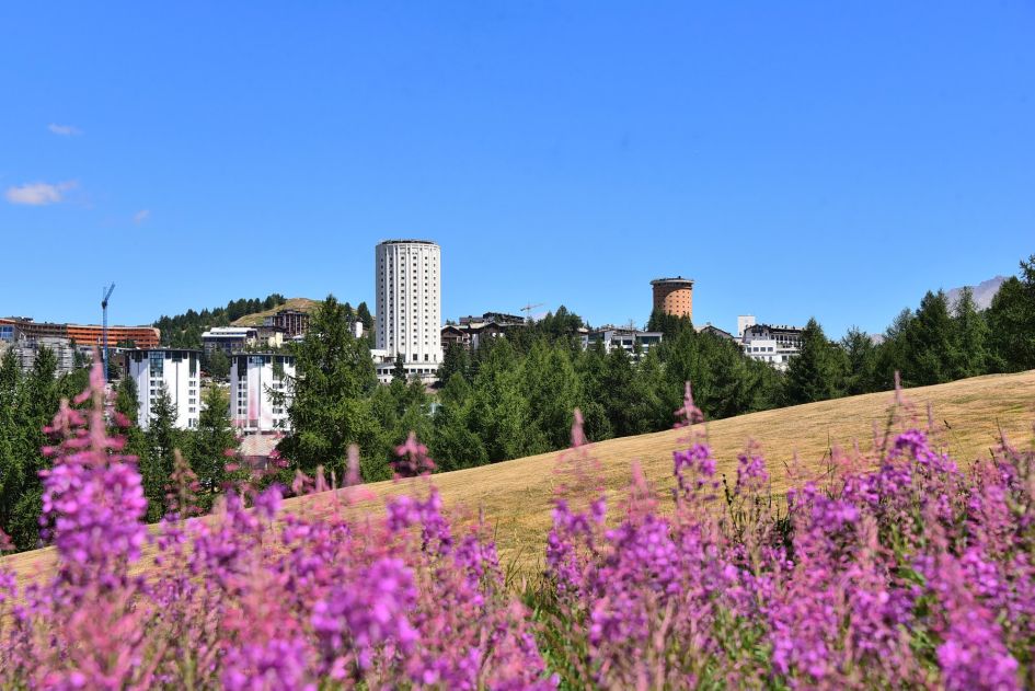 The iconic red and white towers of the resort of Sestriere in summer.