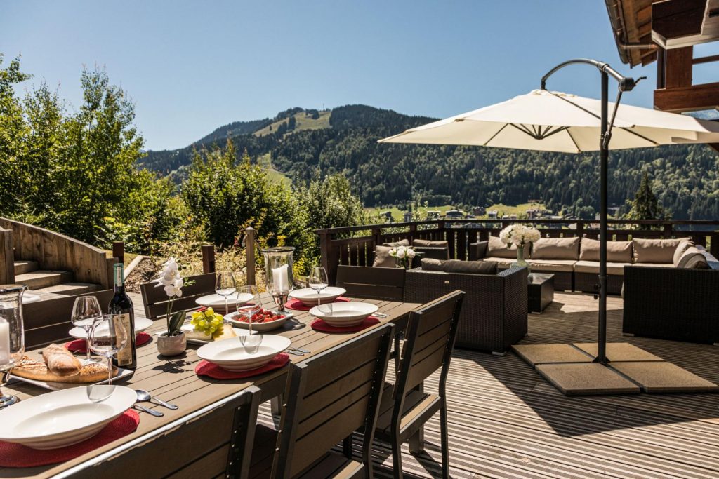 The terrace at Chalet M in Morzine. This luxury self catered summer chalet in France is one of the best for outdoor living.