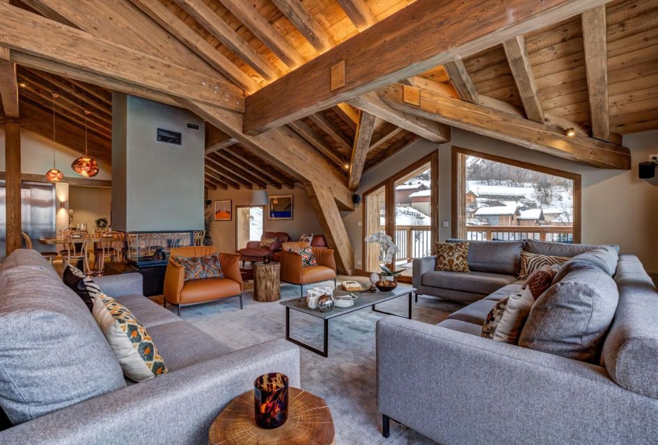 Living room of Chalet Constantia, with stylish orange and slate decor.