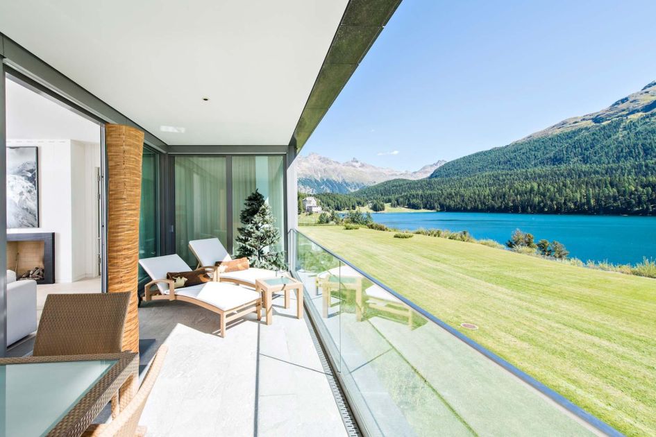 View from the balcony of Apartment Lakeside in St Moritz, that overlooks the mountains and Lake St Moritz itself.