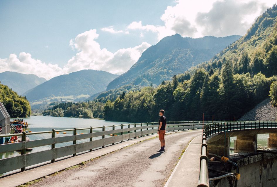 A man stands over the river-fed dams that power several of the sustainable chalets in Morzine, making for a great addition to an eco-conscious summer mountain holiday in Morzine.